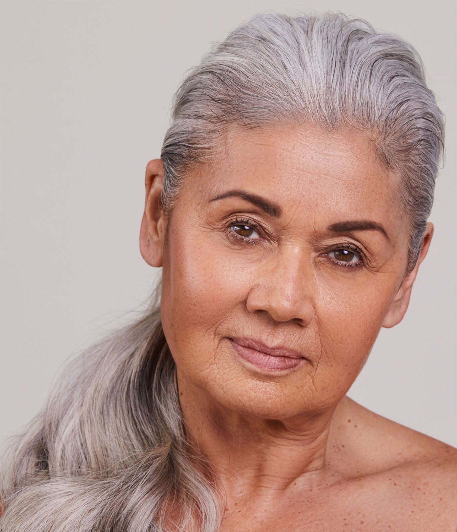 Model wears The One Moisture Cream & Mixing/Treatment Balm