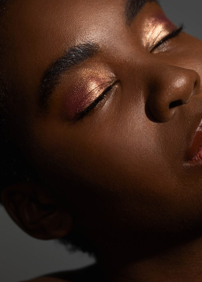 Close-up of model wearing Aleph beauty Hybrid Eye pigment